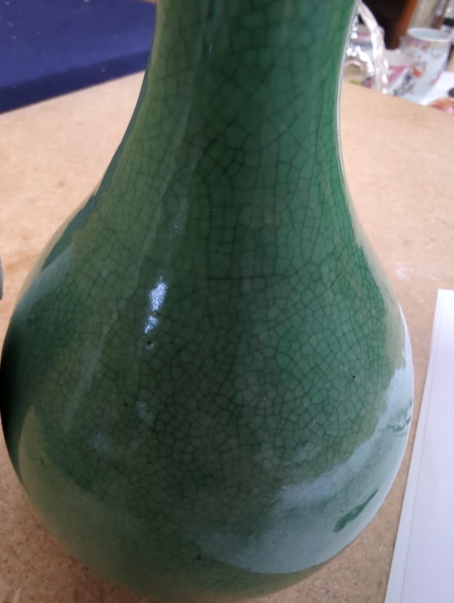 An early 20th century Chinese green crackle glazed vase (a.f.). 17cm.